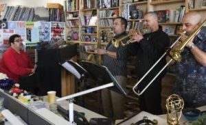 Arturo O'Farrill in NPR's Tiny Desk Concert with 7 members of his Afro-Cuban Jazz band.