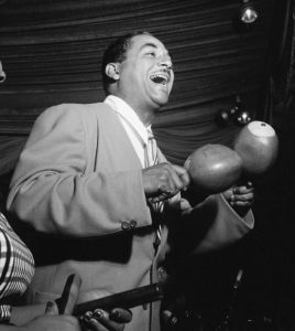 Frank "Machito" Grillo playing the maracas with his Afro-Cubans.