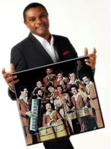 Jose Alberto "El Canario" with photo of Tipica 73