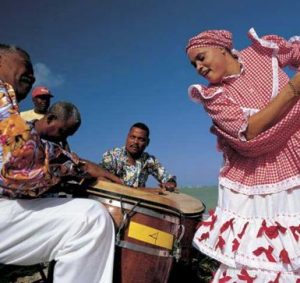 Woman dancing different types of Bomba.