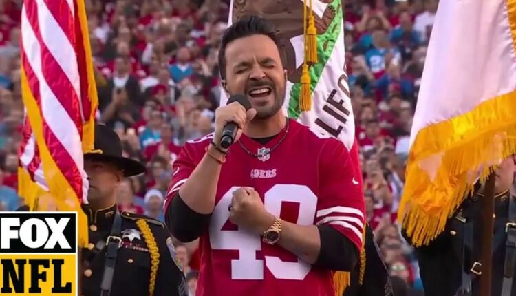 Luis Fonsi singing the national anthem at NFC game.